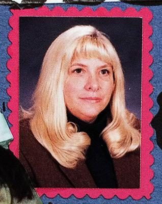 Color head-and-shoulders portrait of teacher Nancy Harris from our 1995 to 1996 yearbook. 